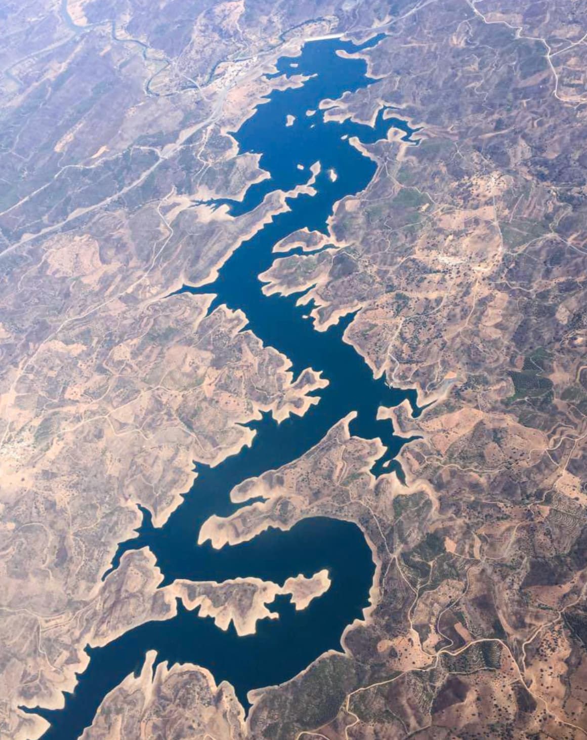 “The blue Dragon river in Portugal seen from Space.”